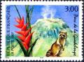 timbre N° 3055, Parc de la Guadeloupe, volcan de la Soufrière, fleur de balisier et racoon (raton laveur)